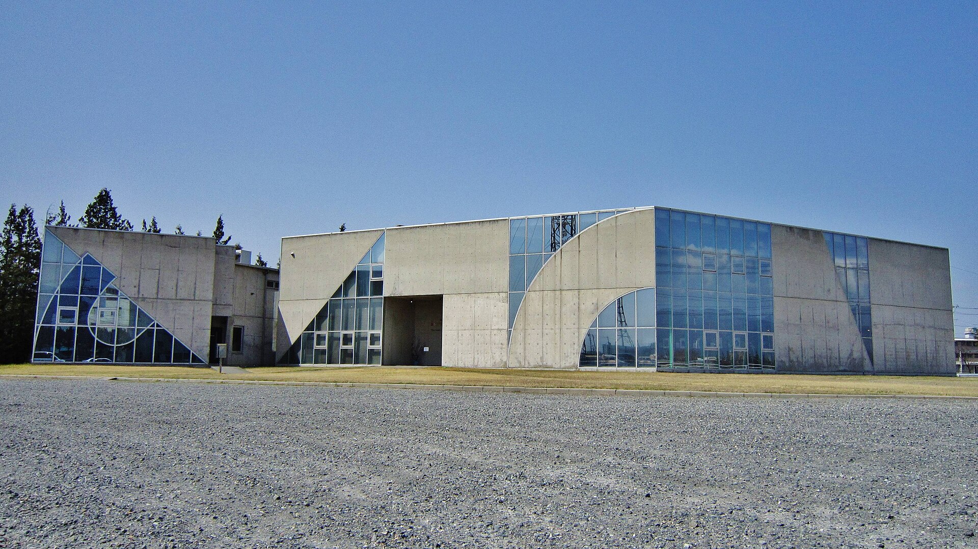The concrete and glass exterior of the Japan Ukiyo-e Museum.
